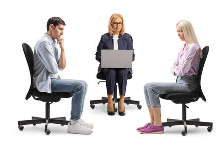 Woman using a laptop computer at a couple counselling session isolated on white backgroundの写真素材
