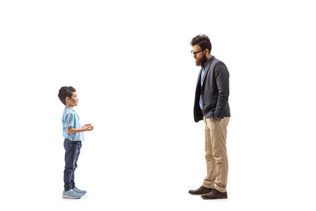 Boy talking and explaining something to a man isolated on white backgroundの写真素材