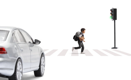 Schoolboy running on a street and car waiting at a zebra crossing isolated on white backgroundの写真素材