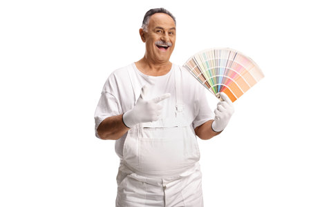 House painter pointing at a color palette isolated on white backgroundの写真素材
