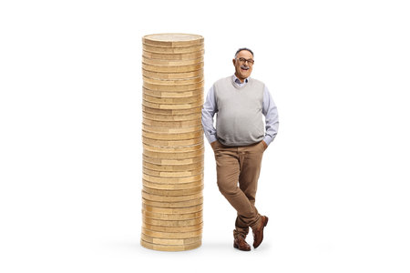 Full length portrait of a mature man leaning on a big pile od coins isolated on white backgroundの写真素材