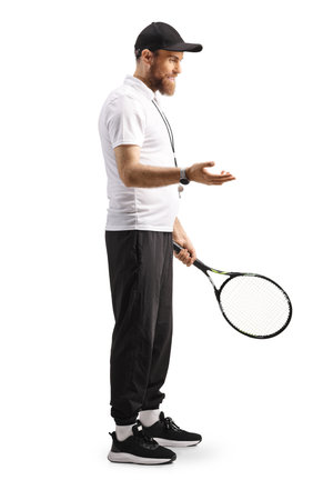 Tennis coach holding a racquet and talking isolated on white backgroundの写真素材