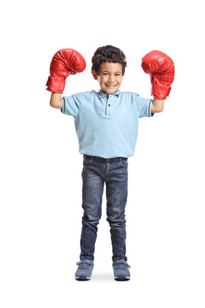 Cute asian boy with red boxing gloves isolated on white backgroundの写真素材