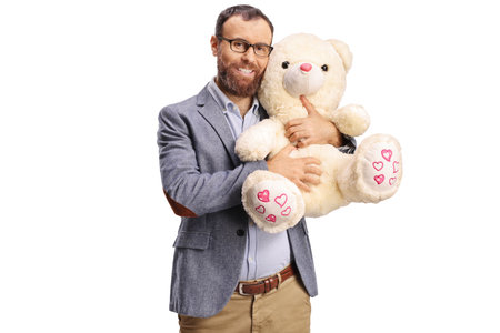Adult hugging a teddy bear isolated on white backgroundの写真素材