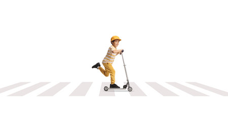 Boy riding a two wheeled scooter at zebra crossing isolated on white background