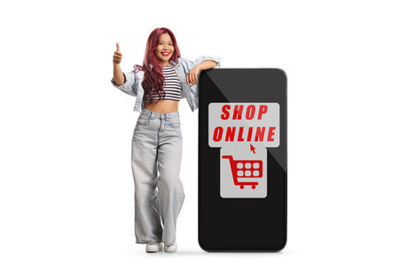 Asian woman and a smartphone with text shop online isolated on white backgroundの写真素材
