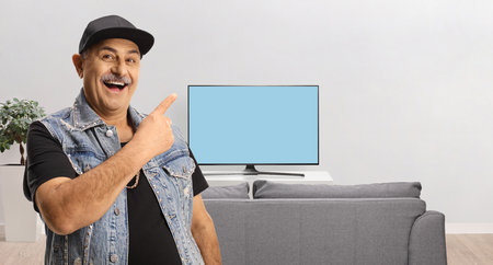 Man pointing at a tv screen at home
