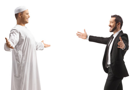 Businessman meeting a middle eastern friend in ethnic clothes isolated on white backgroundの写真素材