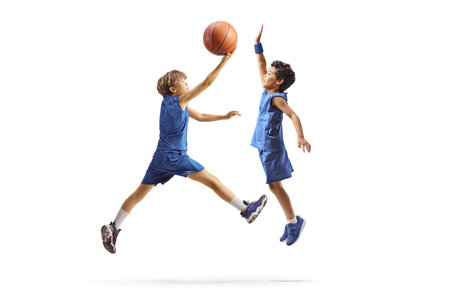 Kids playing basketball and jumping isolated on white background