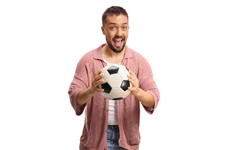 Excited man holding a football isolated on white backgroundの写真素材