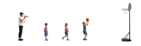 Kids at basketball training and coach with a megaphone isolated on white backgroundの写真素材