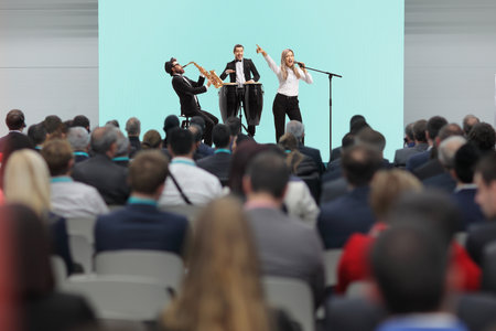 Music band performing on stage in front of audienceの写真素材