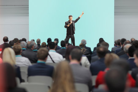 Male singer performing on stage in front of audienceの写真素材