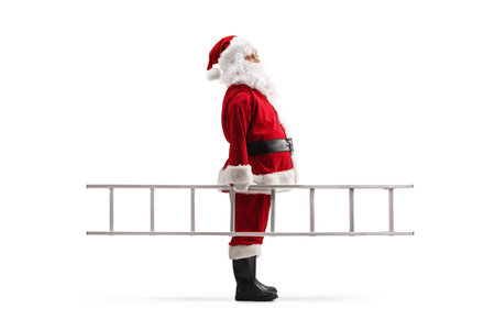 Full length profile shot of Santa Claus standing and holding a ladder isolated on white backgroundの写真素材