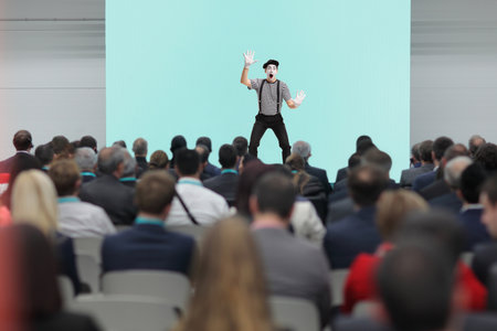 Mime performing on stage in front of people in the audienceの写真素材
