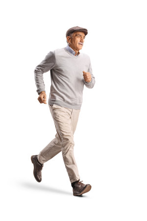 Full length shot of a senior man in casual clothes running isolated on white backgroundの写真素材