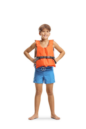 Full length portrait of a boy wearing a swim vest isolated on white backgroundの写真素材