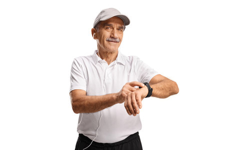 Mature man in sportswear with a smart watch isolated on white backgroundの写真素材