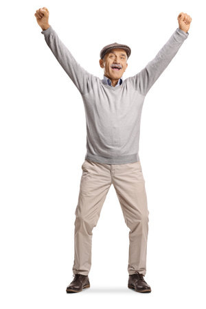 Overjoyed elderly man gesturing happiness with raised arms isolated on white backgroundの写真素材