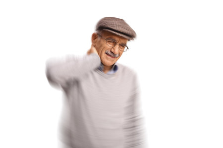 Elderly man suffering from pain in the neck and dizziness isolated on white backgroundの写真素材