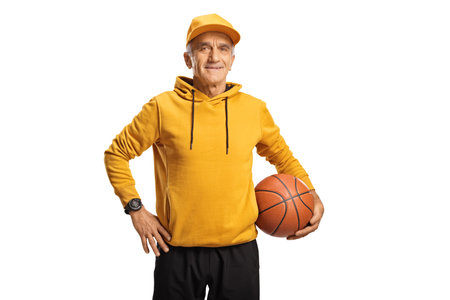 Cool senior man holding a basketball isolated on a white backgroundの写真素材