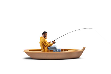 Fisherman in a boat pulling a fishing rod isolated on white backgroundの写真素材