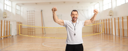 Coach with a whistle at a sports hallの写真素材