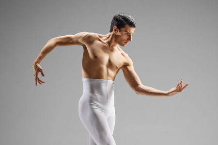 Ballet dancer in white tights performingの写真素材
