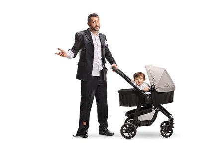 Exhausted father with baby in a pushchair isolated on white backgroundの写真素材