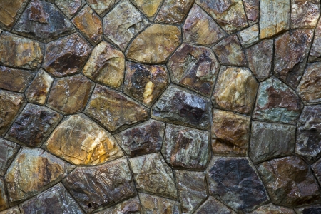 Wet round stone rock texture with tiny water drops の写真素材
