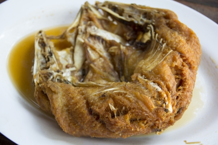 Fried snapper at a seafood restaurant in Thailand  Shallow depth of field  