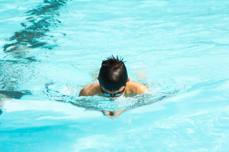 breast stroke in the outdoor swimming pool.の写真素材
