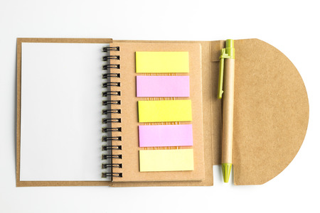 Notebook and postit and pen isolate on white background with copy space for text.