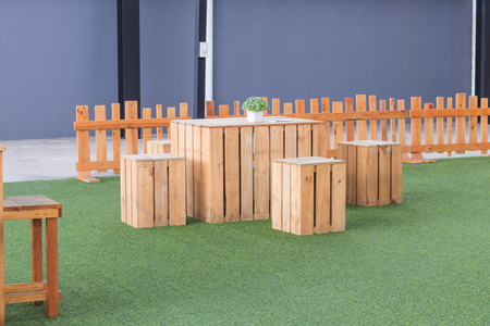 The wooden table and chair on green grass.の写真素材
