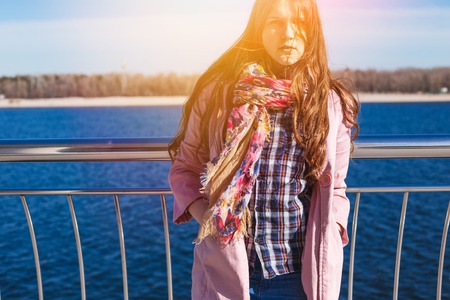 Teen girl relax in city park. Spring sunny dayの写真素材