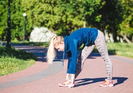 Fitness woman doing exercises during outdoor cross training workout