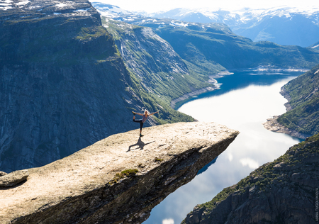 Happy woman enjoy beautiful lake and good weather in Norway.の写真素材