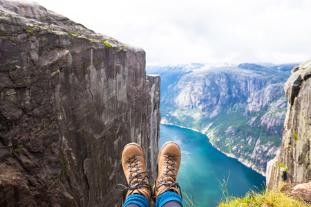 Happy people relax in cliff during trip Norway. hiking routeの写真素材
