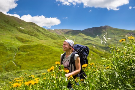 Happy hiker enjoy beautiful mountains. Relax summer timeの写真素材