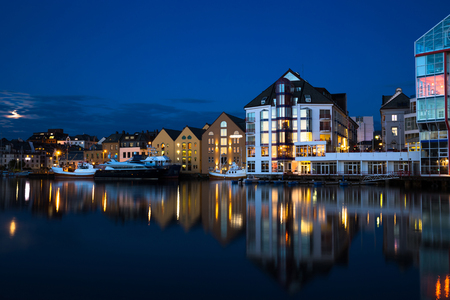 Night view of Alesund. Beautiful lights and reflections in sea. Norwayの写真素材
