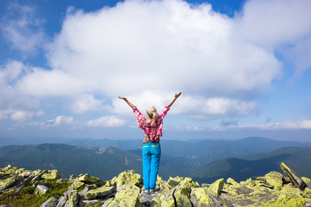 Happy hiker enjoy beautiful mountains. Relax summer timeの写真素材