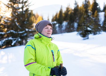 Woman relax in mountains during winter hiking.の写真素材