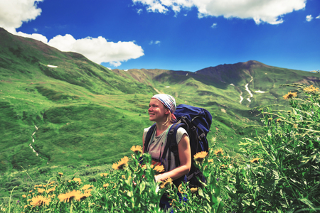 Happy hiker enjoy beautiful mountains. Relax summer timeの写真素材
