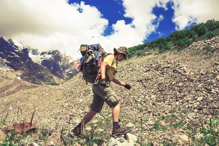 Happy hiker enjoy beautiful mountains. Relax summer timeの写真素材