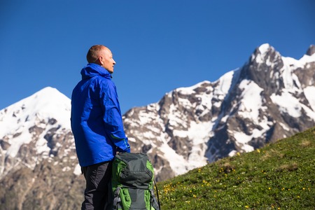 Happy hiker relax on beautiful mountains landscapeの写真素材