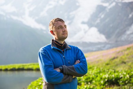 Happy hiker relax on beautiful mountains landscapeの写真素材