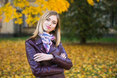 Happy teen girl smile during walking on autumn park.の写真素材