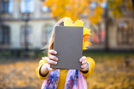 Happy teen girl smile during walking on autumn park. Fall conceptの写真素材