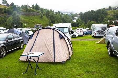 Motorhomes at campsite by the Geirangerfjord in Norway. Concept pictures