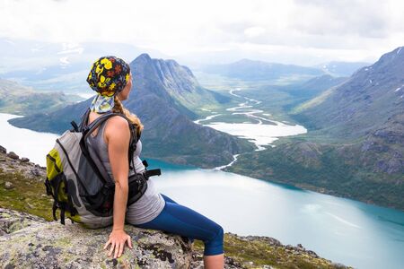 Happy sport woman hiking in Bassegen. Norwayの写真素材